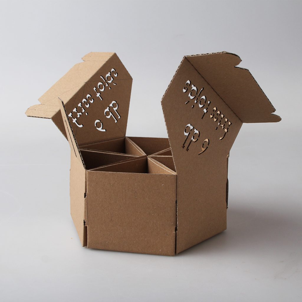 Découpe de texte dans une boite en carton kraft au laser CO₂