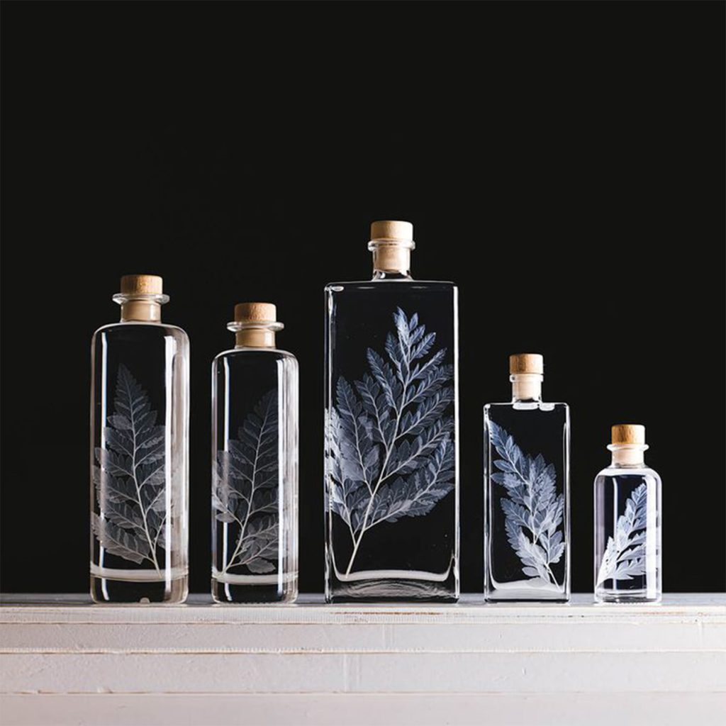 Bouteilles pour cosmétique en verre avec gravure au laser UV